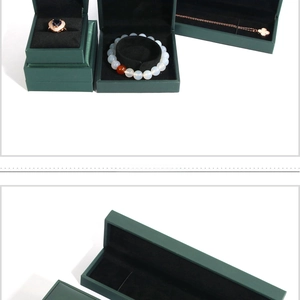 Macro view of dark green solid wood jewelry boxes with black velvet lining details