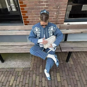 Vintage denim jacket with white floral embroidery and casual striped pants set