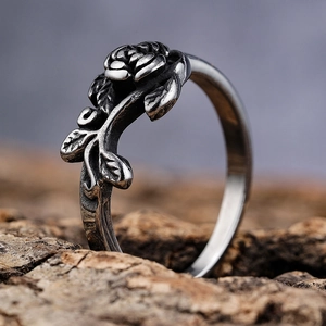 Vintage 316 stainless steel rose flower ring with antique silver finish on wood bark