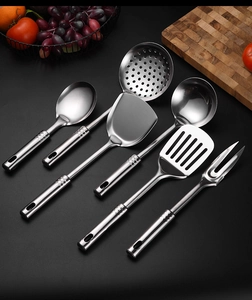 Macro view of 6-piece thick stainless steel kitchen utensil set with seamless handles