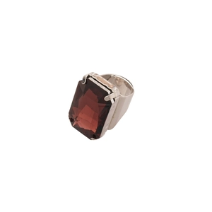Luxe silver ring with large wine red square gemstone on a clean white background