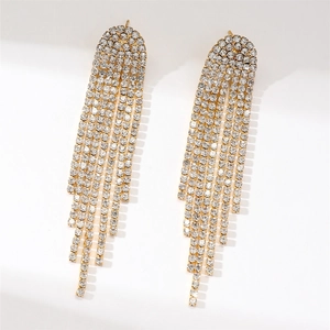 Detailed view of long gold tassel earrings featuring rows of sparkling rhinestones