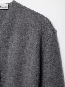 Detailed view of dark grey wool coat neckline with MWOMAN size S brand label