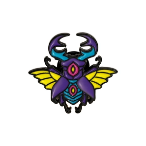 Vibrant beetle alloy brooch with purple body and blue wing patterns on white background