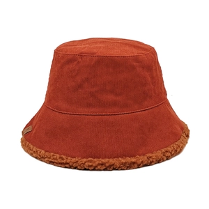 Detail of corduroy bucket hat with faux shearling brim and small leather logo patch
