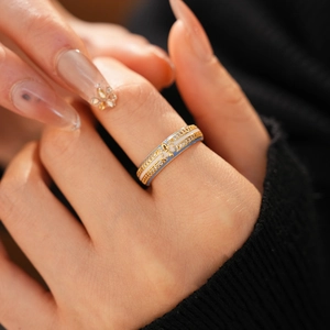 Detailed view of 18k gold plated ring with blue enamel iris and sparkling zircon pavé