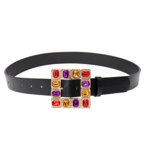 Fashionable black leather belt featuring a gold square buckle with colorful gemstones