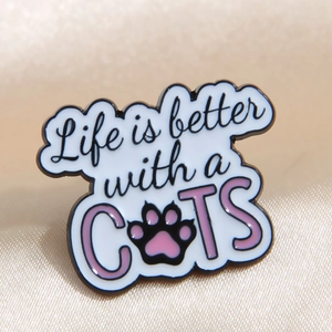 Enamel cat brooch with Life is Better with a Cat text on cream silk background