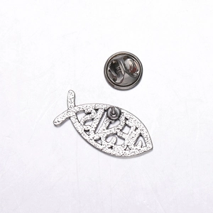 Detail view of silver hollow Jesus fish brooch with textured metal finish and secure clutch