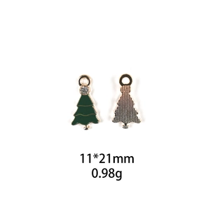Detail of Christmas tree pendant with green enamel, zircon inlay and back metal texture