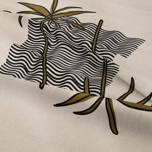 Macro detail of bohemian wall tapestry showing fine woven texture and leaf print pattern