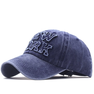 Vintage navy blue washed cotton baseball cap with New York patch embroidery and curved brim