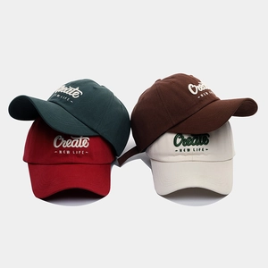 Close-up of premium 3D embroidery detail on cotton twill baseball caps in various colors