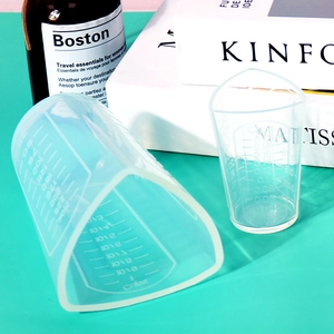 Detailed view of clear silicone measuring cups with precise ml and cup scale markings