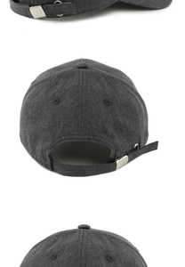 Detail of dark grey baseball cap featuring adjustable metal buckle and breathable eyelets