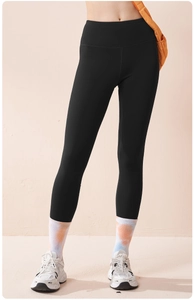 Detailed shot of high-waisted black yoga leggings showcasing slim fit and elastic fabric