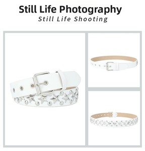 Detail of white leather belt featuring silver star studs and a square pin buckle design