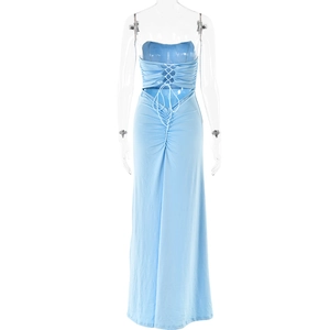 Detail view of the back of a light blue maxi dress featuring lace-up straps and pleated design