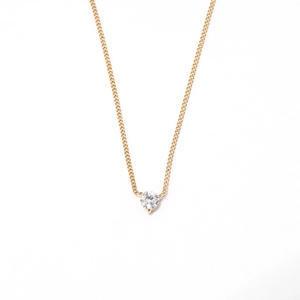 Minimalist gold necklace featuring a sparkling round zircon heart pendant in claw setting