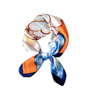 Elegant floral silk square scarf with bright orange and blue artistic patterns on white