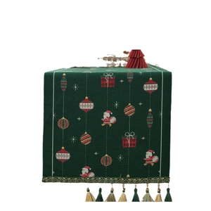 Christmas table runner with green jacquard Santa motifs and decorative tassels