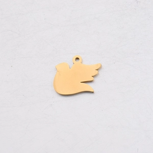 Polished gold stainless steel dove pendant for DIY jewelry making on white surface