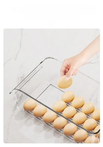 Detail of transparent egg storage box with non-slip bottom ribs and drawer design