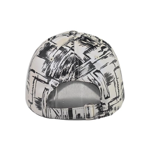 Detail view of tie-dye baseball cap featuring graffiti print and adjustable metal buckle