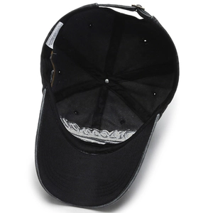 Internal structure of washed black cotton baseball cap with metal buckle and silver embroidery