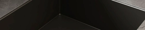 Close-up of matte black stainless steel kitchen organizer showing premium corner finish
