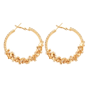 Golden oversized geometric circle hoop earrings with sparkling crystal cluster details