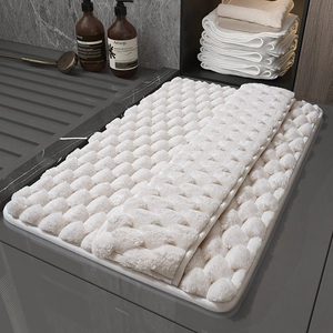 Absorbent memory foam bath mat in cream white with premium square quilted texture