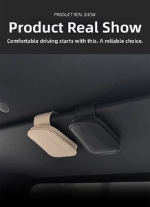 Car sun visor organizer showing black and beige leather glasses clips with fine stitching