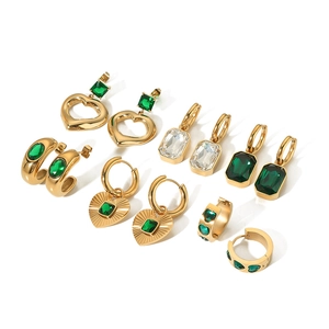 Collection of gold earrings with emerald green heart and rectangular zircon stones