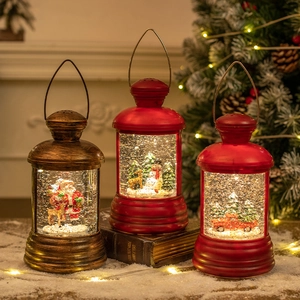 Three Christmas lantern music boxes with liquid glitter, Santa and Snowman scenes