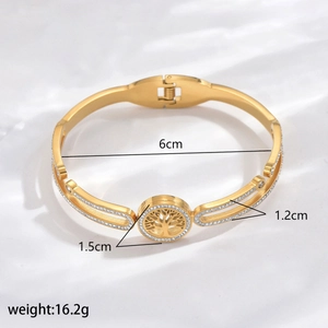 Detail view of gold Tree of Life bracelet with size markings 6cm and 1.2cm width