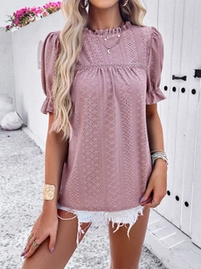Close-up of pink lace hollow-out top featuring bubble sleeves and ruffle stand collar