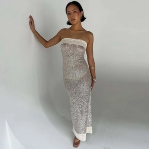Detail of silver sequined strapless maxi dress with white contrast trim and sleek fit
