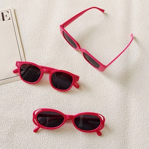 Three pairs of stylish pink frame sunglasses with dark lenses in diverse frame shapes