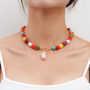 Bohemian necklace featuring colorful natural stones and a white baroque pearl pendant