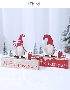 Close-up of wooden Merry Christmas signs with festive gnomes and mini pine trees