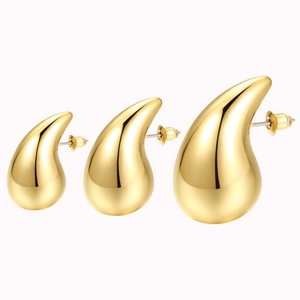 Three pairs of water drop gold earrings in small, medium and large sizes on white background