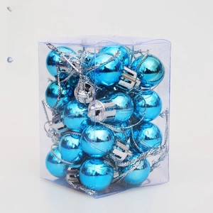 Detail of lake blue Christmas ball ornaments with silver strings in a transparent box