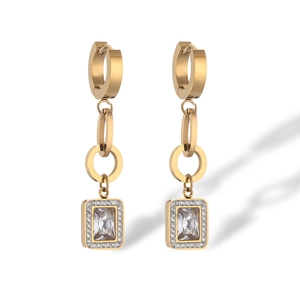 Detail view of gold-plated geometric drop earrings with rectangle crystals and small diamonds