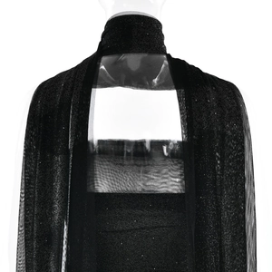 Close-up of the elegant black glitter mesh fabric on the back and neck of the dress