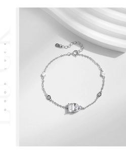 Macro shot of S925 sterling silver bracelet with rectangle and heart-shaped zircons