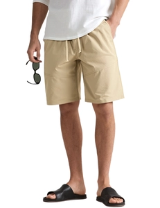 Detailed view of khaki drawstring shorts with elastic waistband and side pockets