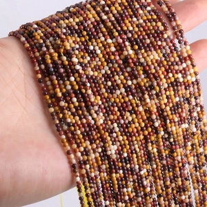 Detail of 2mm and 3mm natural agate and tiger eye stone beads in mixed earthy colors