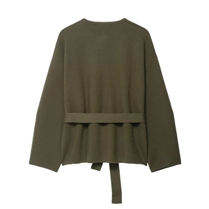 Detailed view of army green knitted cardigan featuring a stylish waist belt tie design