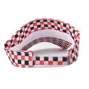 Detailed view of checkered sun visor hat with orange black pattern and interior stitching